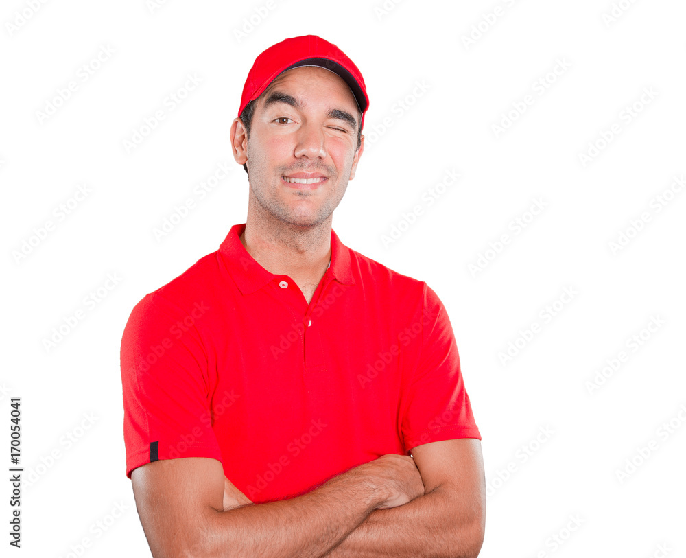 Confident delivery man winking an eye Confident delivery man winking an eye