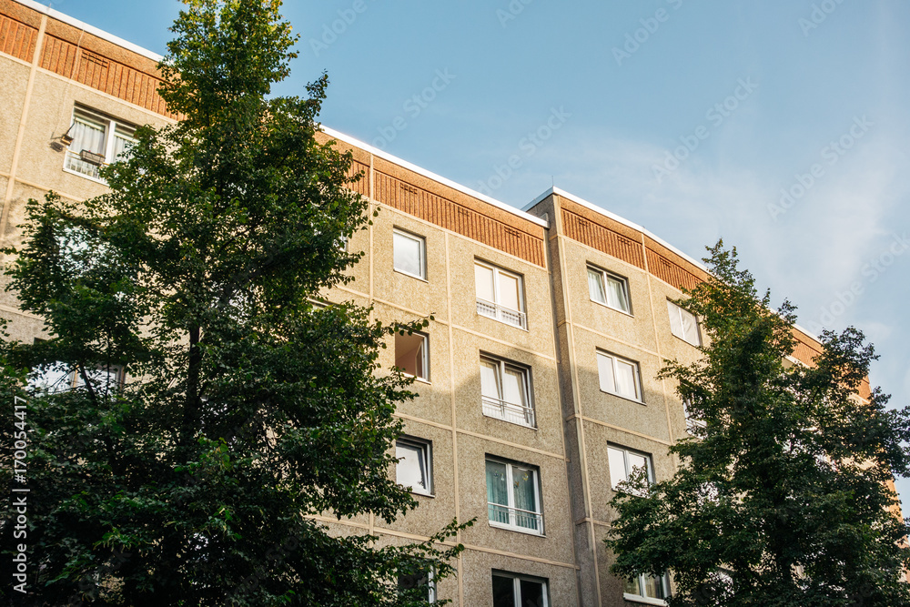 gdr plattenbau building inbetween of fir trees gdr plattenbau building inbetween of fir trees