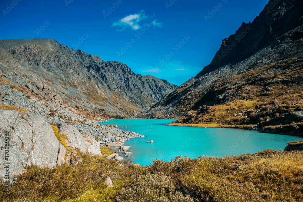 mountain lake in front of mountain range, national park in Altai republic, Siberia, Russia