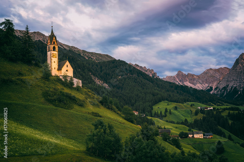 Santa Barbara church (Chiesa Santa Barbara) in La Valle (La Val) in the evening. Trentino Alto Adidge, Dolomites, Italy.