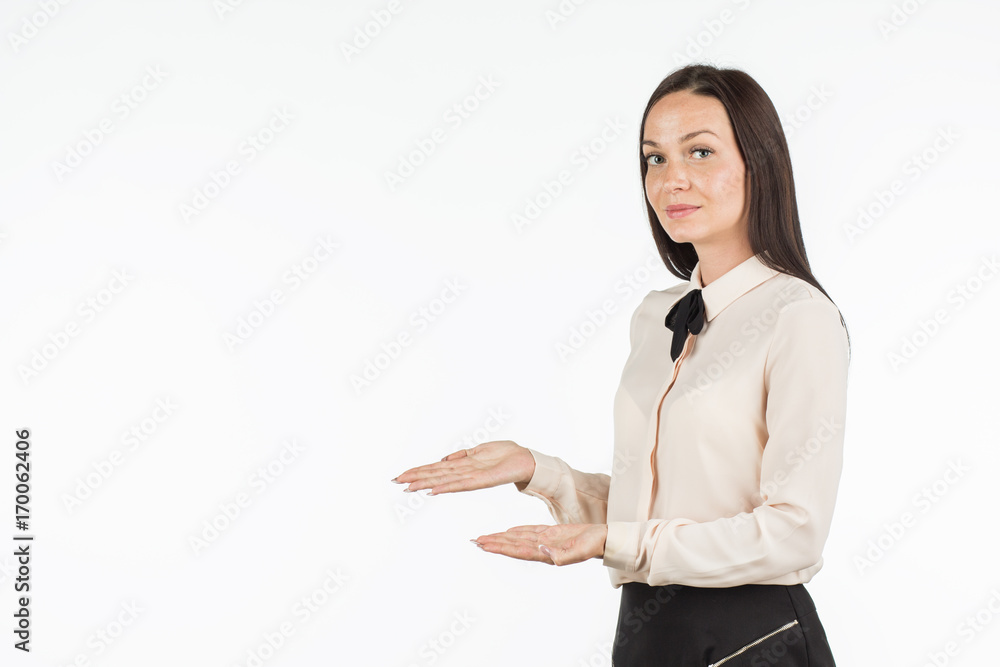 Young beautiful woman points to the object on the left / right. The girl smiles and points to the side. An attractive business lady is advertising something. Place for your text. Young beautiful woman points to the object on the left / right. The girl smiles and points to the side. An attractive business lady is advertising something. Place for your text.