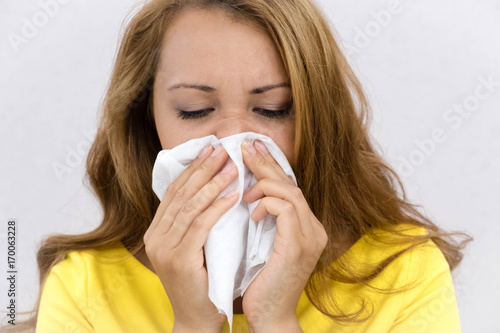 Young Asian woman got sick and flu gray background