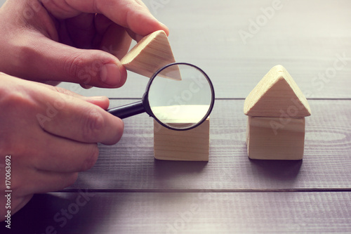 Photo inspection of construction objects/ viewing in a magnifying glass the design of