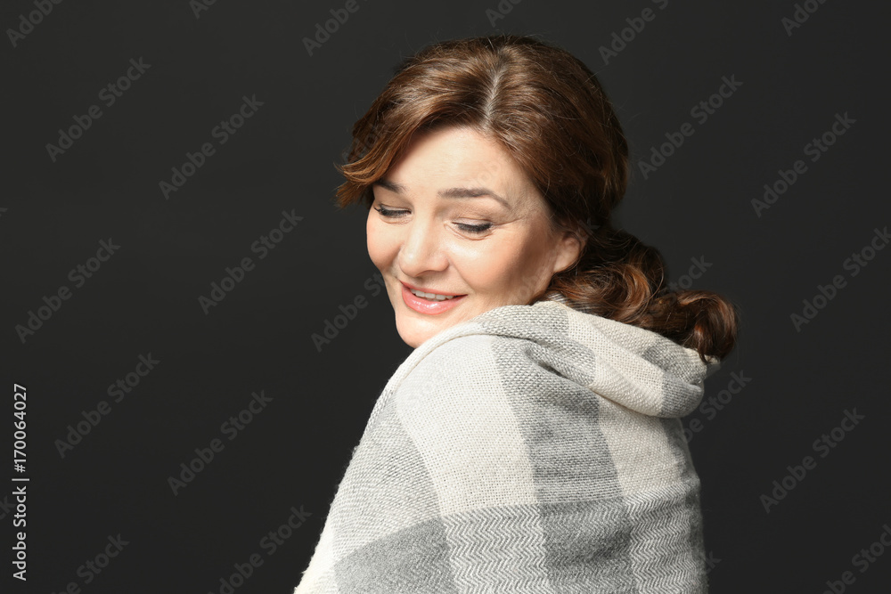 Fototapeta premium Beautiful elderly woman posing on black background