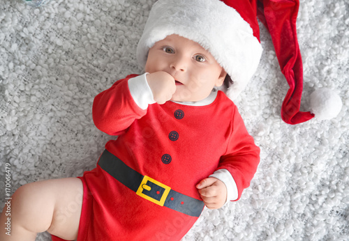 Cute little baby in Santa c...