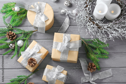 Gift boxes and Christmas decorations on wooden table