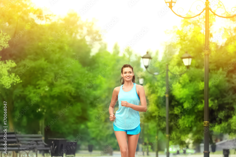 Morning of young sporty woman running in park Morning of young sporty woman running in park