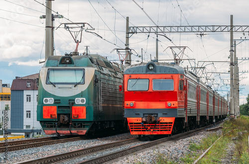 Electric locomotives passing each other on the railway