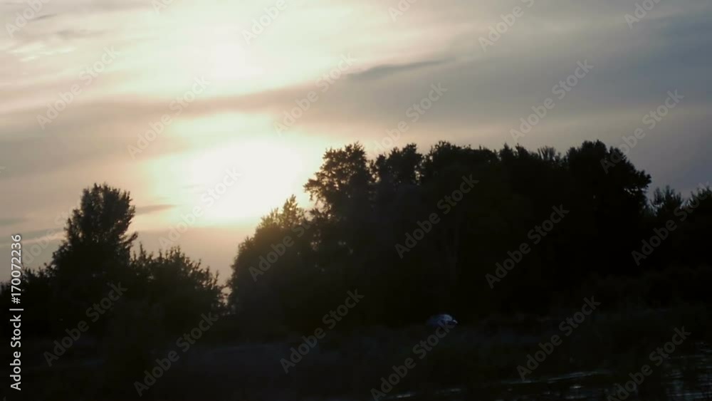 Sunset on the river bank slow motion Sunset on the river bank slow motion