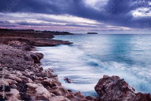 Beautiful colorful sunset at the sea with dramatic clouds and colorful sky. Beauty world natural outdoors travel background. Long exposure