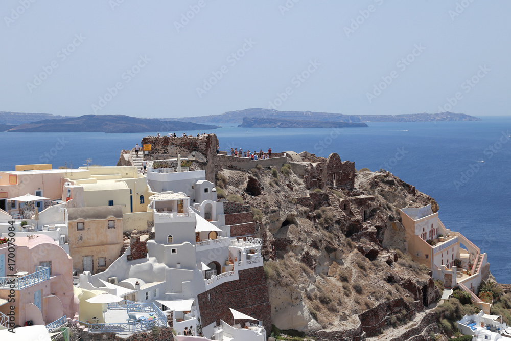 Byzantine castle ruins and Aegean Sea view in the town of Oia, island of Santorini, Greece