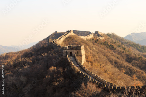 Tourist with open arms at the Great Wall of China. The Great Wall of China is the world's longest wall and biggest ancient architecture photo