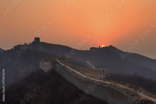 Sunrise at the Great Wall of China. The Great Wall of China is the world's longest wall and biggest ancient architecture