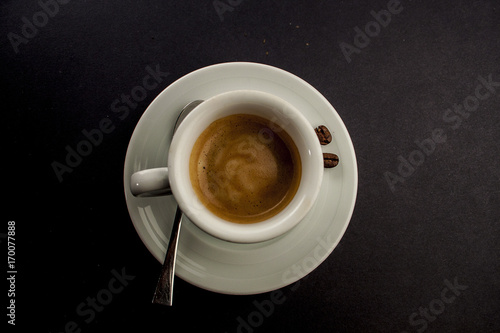 espresso coffee in a cup on a black