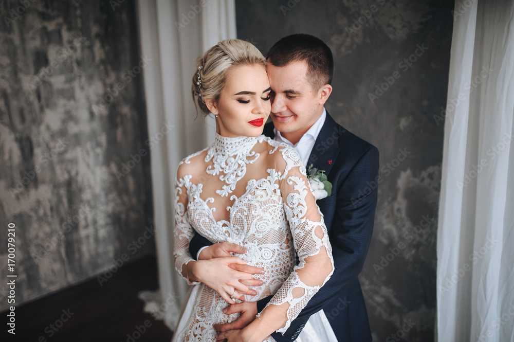 the bride and groom embrace on the wedding day. wedding concept. the bride and groom embrace on the wedding day. wedding concept.