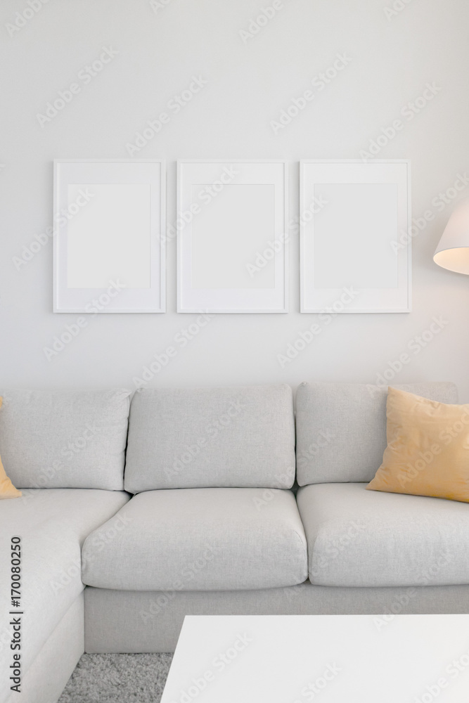 Set of 3 Blank Poster Frames in a Living Room Set of 3 Blank Poster Frames in a Living Room