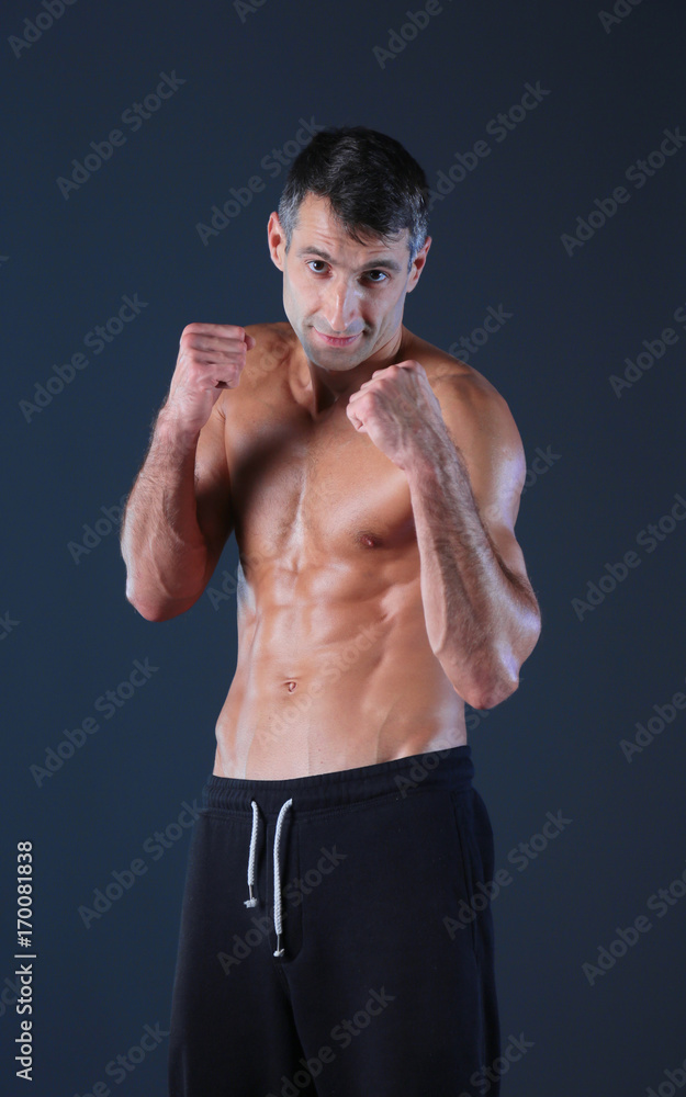 Profile view of young man practicing boxing .Personal instructor. Personal training. Profile view of young man practicing boxing .Personal instructor. Personal training.