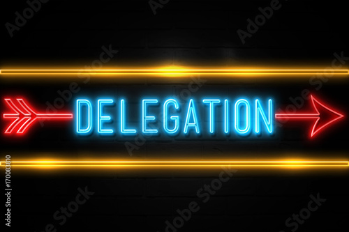 Delegation  - fluorescent Neon Sign on brickwall Front view