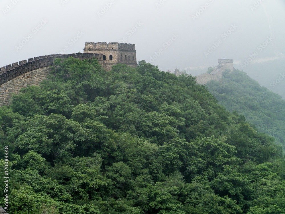 Great Wall of China winding its way into the fog