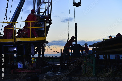 field oil workers at work