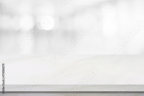 Empty white marble over blur store background, product and food display montage
