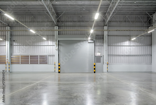 Obraz na płótnie Roller door or roller shutter inside factory, warehouse or industrial building
