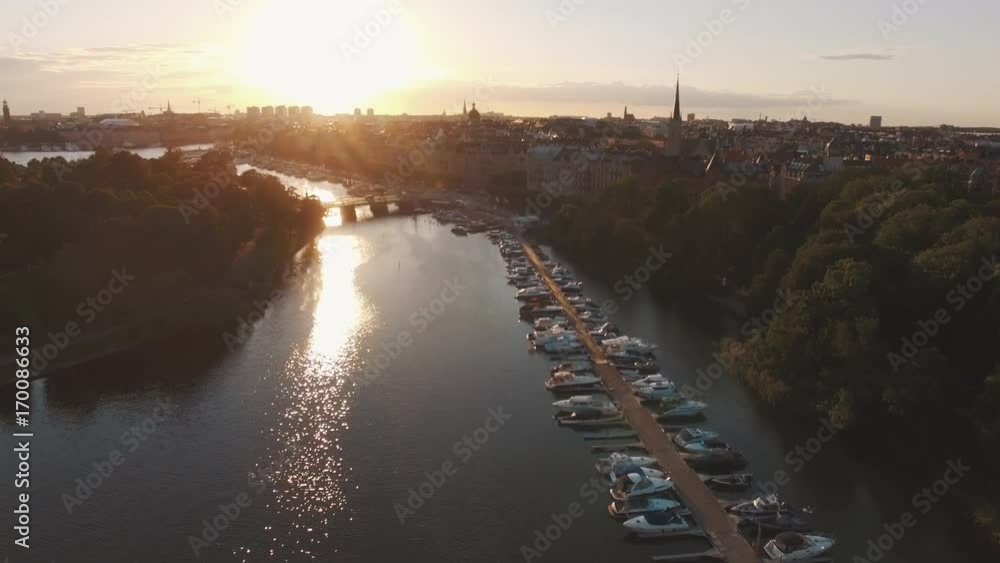 Aerial view of Stockholm city at sunset. Drone shot flying over canal, street and buildings. Capital city of Sweden Aerial view of Stockholm city at sunset. Drone shot flying over canal, street and buildings. Capital city of Sweden
