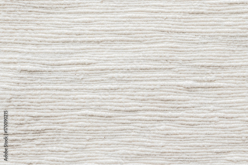 White cotton fabric cloth natural hand-woven burlap texture linen textile background in cream color