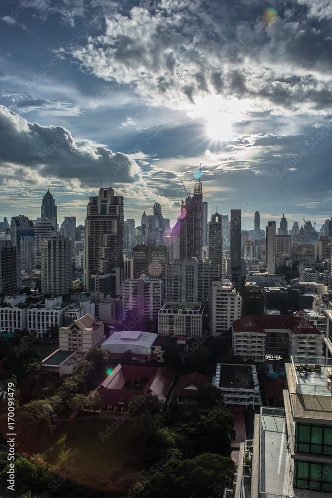 Obraz premium city buildings with shining cloud