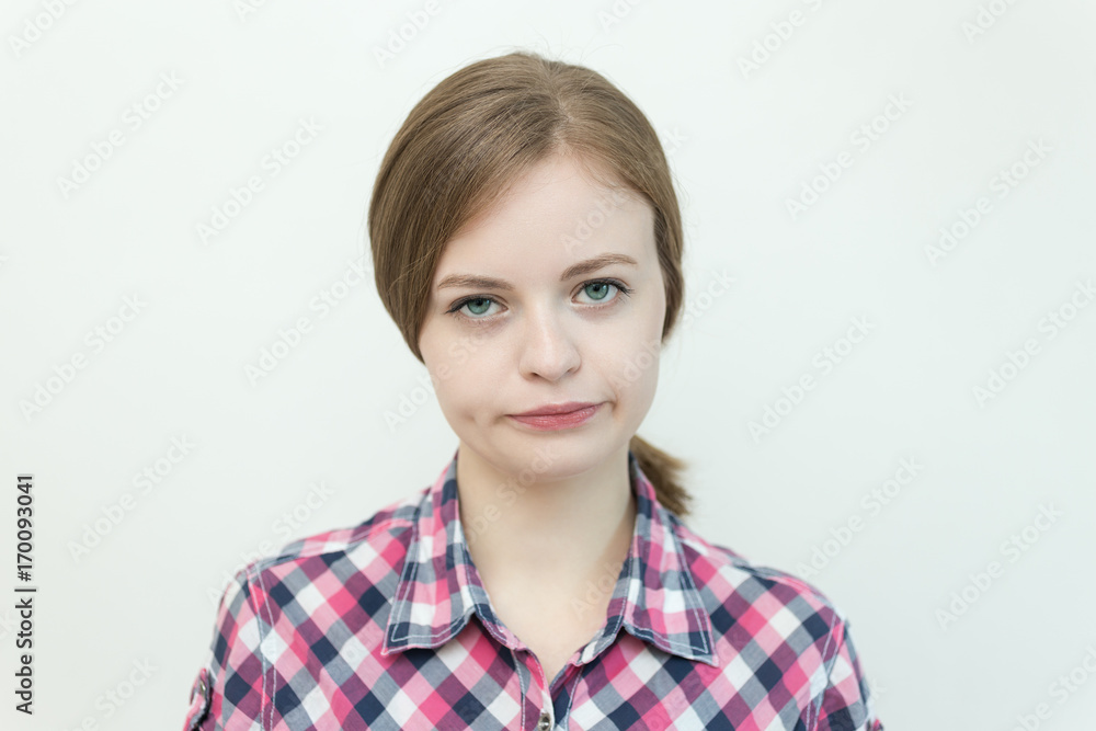 Caucasian young woman with a gloomy, irritated, unhappy face Caucasian young woman with a gloomy, irritated, unhappy face