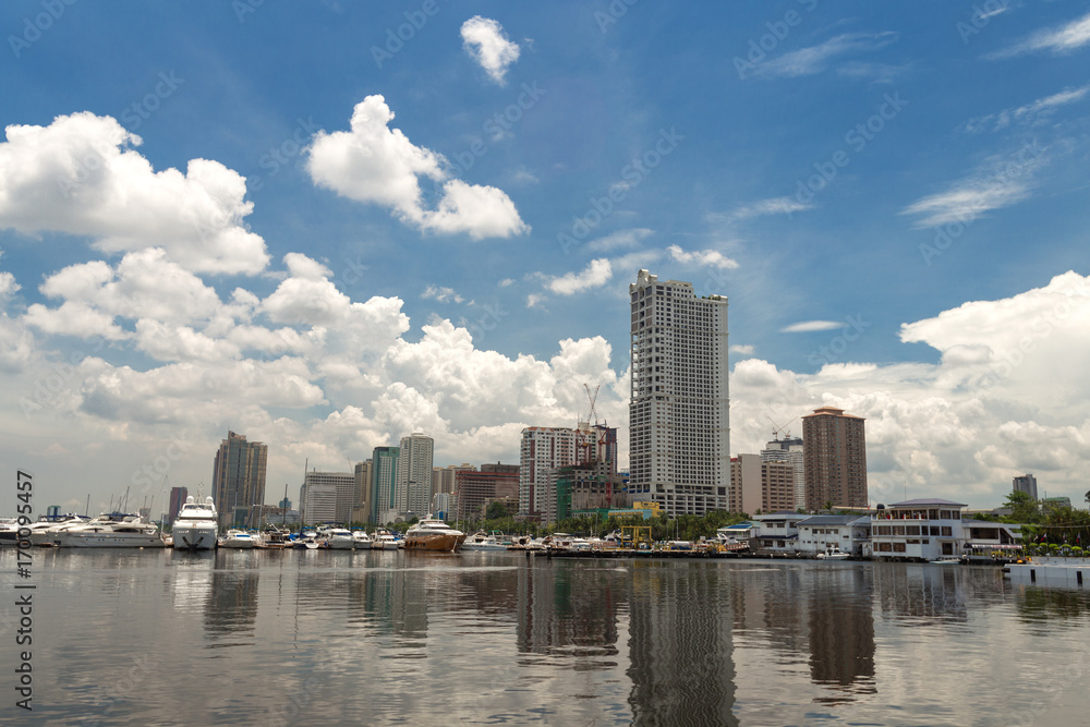 Seascape of Manila bay area, reflecting sea and big city behind