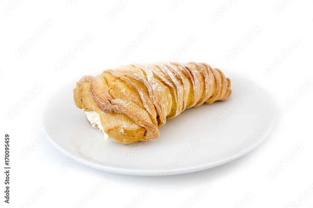 Italian pastry. sweet lobster tail. sfogliatella riccia on the plate. isolated on white background