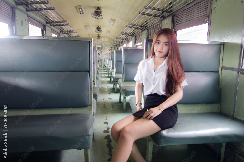 Portrait of thai adult student university uniform on train transport Portrait of thai adult student university uniform on train transport