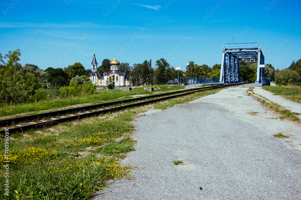 Fototapeta premium Bolderaja Bridge and Orthodox Church on the other side Bolderaja, Riga, Latvia