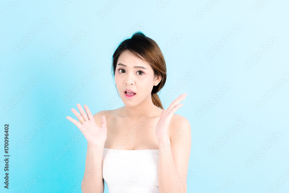 Asian young beautiful confidence woman smiling portrait posing surprises over blue background. Asian young beautiful confidence woman smiling portrait posing surprises over blue background.