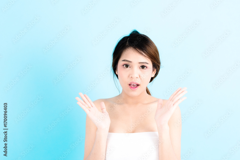 Asian young beautiful confidence woman smiling portrait posing surprises over blue background. Asian young beautiful confidence woman smiling portrait posing surprises over blue background.