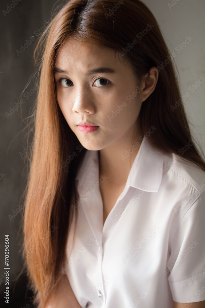 Portrait of thai adult student university uniform beautiful girl relax and smile Portrait of thai adult student university uniform beautiful girl relax and smile