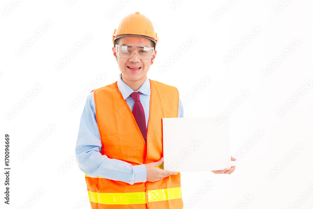 Young confident asian man, orange safety hat, orange safety jacket, safety glass, red tie, blue shirt on white holding white card. Young confident asian man, orange safety hat, orange safety jacket, safety glass, red tie, blue shirt on white holding white card.