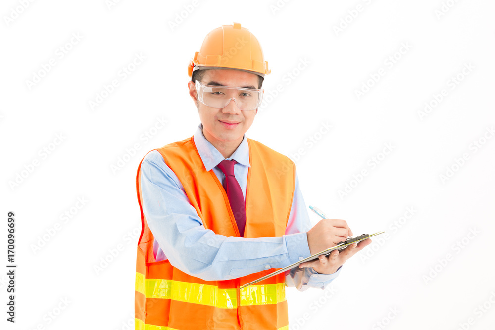 Young confident asian man, orange safety hat, orange safety jacket, safety glass, red tie, blue shirt on white writing on note pad. Young confident asian man, orange safety hat, orange safety jacket, safety glass, red tie, blue shirt on white writing on note pad.