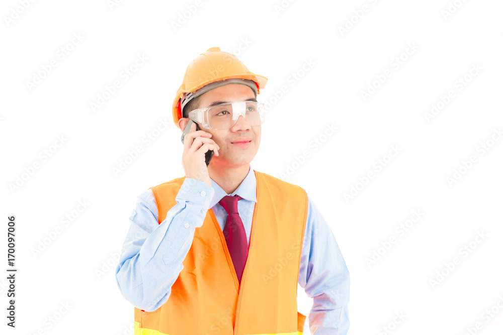 Young confident asian man, orange safety hat, orange safety jacket, safety glass, red tie, blue shirt on white using smart device. Young confident asian man, orange safety hat, orange safety jacket, safety glass, red tie, blue shirt on white using smart device.