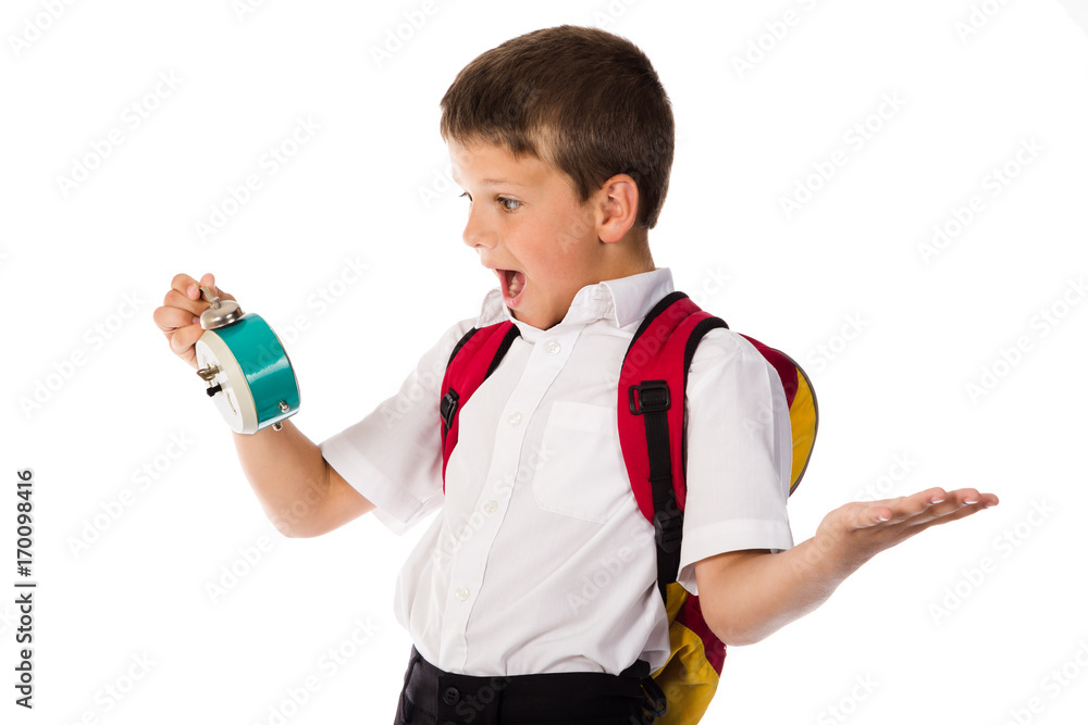 Amazed schoolboy with alarm clock in hand Amazed schoolboy with alarm clock in hand