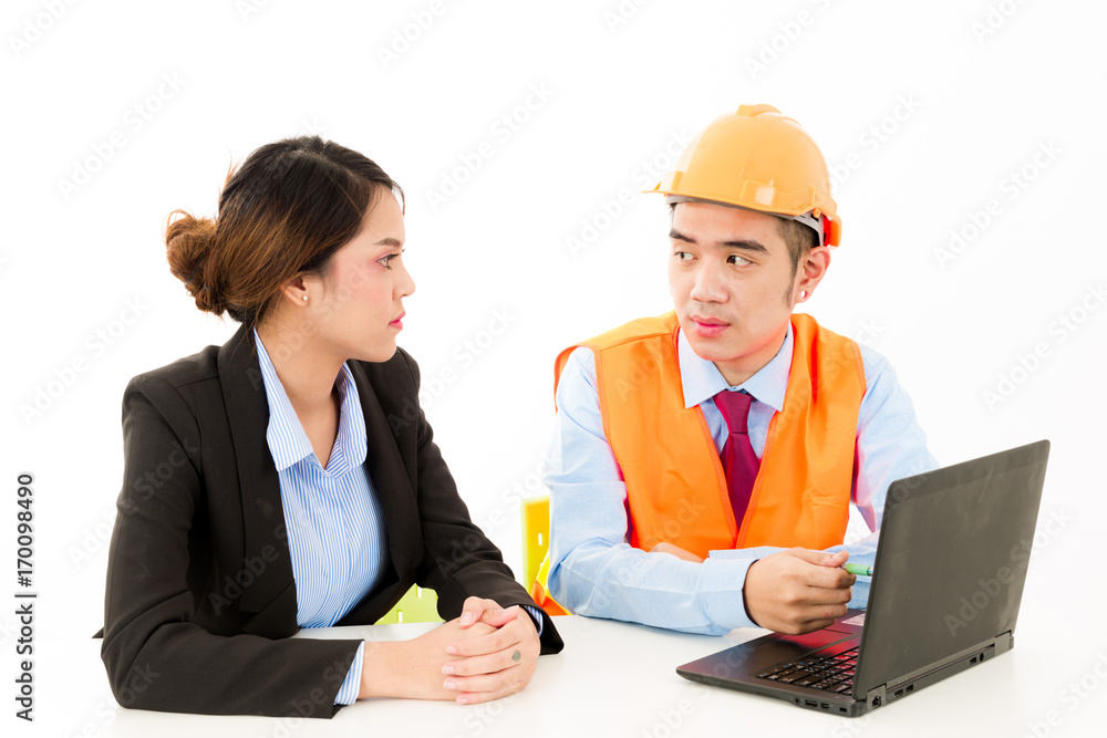 Young Asian male engineer talking to female business woman on white background. Young Asian male engineer talking to female business woman on white background.
