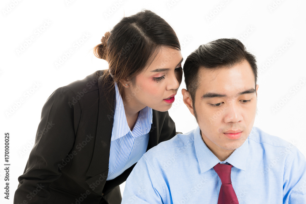 Young confident Asian office employee business woman whisper close to attractive Asian office man ear. Young confident Asian office employee business woman whisper close to attractive Asian office man ear.