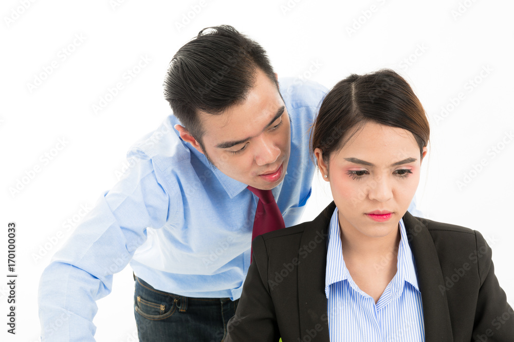 Young confident Asian office employee business man whisper close to attractive Asian office woman ear. Young confident Asian office employee business man whisper close to attractive Asian office woman ear.