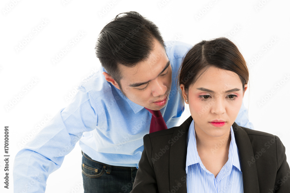 Young confident Asian office employee business man whisper close to attractive Asian office woman ear. Young confident Asian office employee business man whisper close to attractive Asian office woman ear.