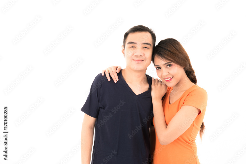 Young confident attractive Asian blue shirt man and orange woman lover couple loving portrait on white background. Young confident attractive Asian blue shirt man and orange woman lover couple loving portrait on white background.