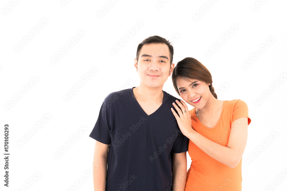 Young confident attractive Asian blue shirt man and orange woman lover couple loving portrait on white background. Young confident attractive Asian blue shirt man and orange woman lover couple loving portrait on white background.