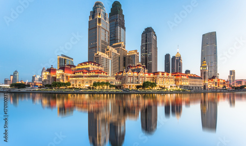 illuminated city waterfront downtown skyline with Haihe river,Tianjin,China. photo