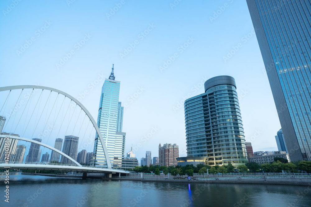 Tianjin Hai river waterfront downtown skyline with dagu bridge ,China.