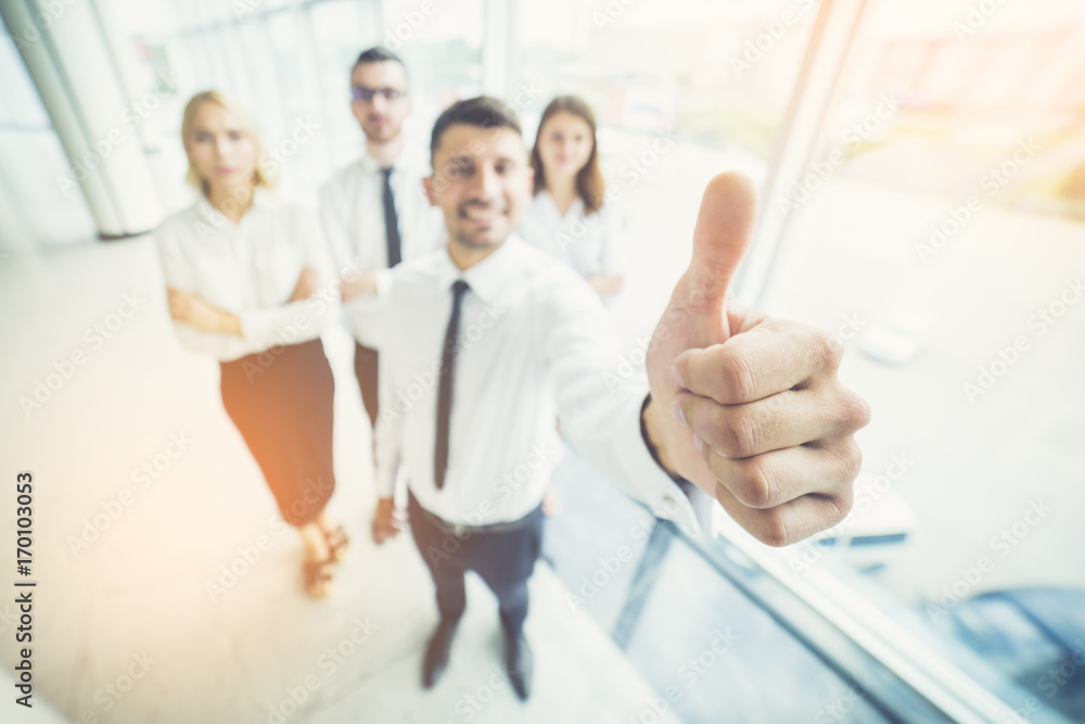 The business people thumb up in the sun background The business people thumb up in the sun background